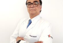 Experienced neurosurgeon examining brain scan in a modern clinic.